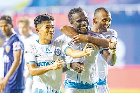 Jamshedpur FC players celebrate after scoring a goal