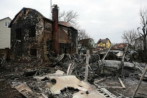 Wreckage of an unidentified aircraft that crashed into a house
