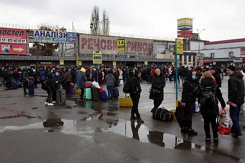 People gathered at a bus station as they try to leave the city of Kyiv (Image Courtesy: Reuters)