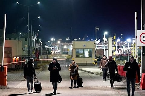 People exit border crossing station after fleeing from war-hit Ukraine (Image credit: Reuters)