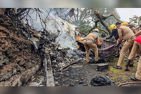 Rescue officials at the spot where IAF Mi-17V5 helicopter crashed in Coonoor (Image credit: PTI)
