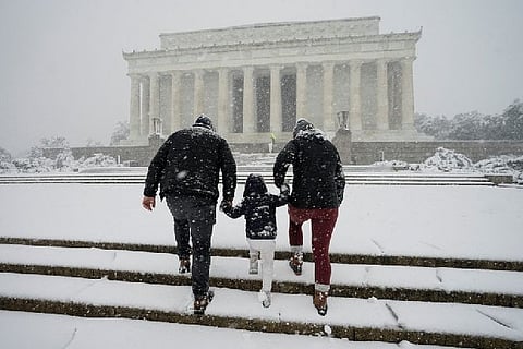 A family walking to the Lincoln memorial. Image Courtesy: Reuters