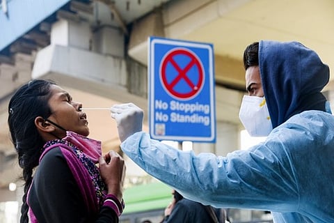 A health worker taking a swab sample (Image credit: ANI)