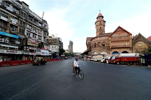 A man rides his bicycle during a lockdown (Credit: Reuters)
