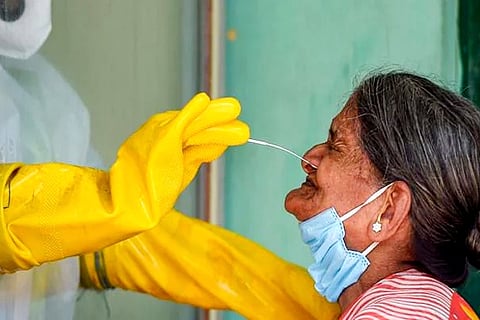 A healthworker collecting swab for Covid testing