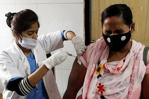 A health worker administers Covid dose to a person (Image credit: ANI)