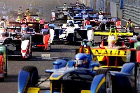 Formula E cars drive into a corner during the Formula E Championship race (Credit: Reuters)