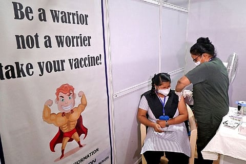 A student reacts as she receives a dose of Bharat Biotech's Covid-19 vaccine (Credit: Reuters)