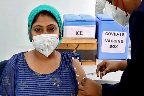 A healthcare worker receives a dose of Covishield (Credit: Reuters)