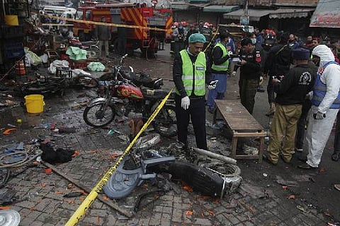Police cordoning the blast site. Image Courtesy: Reuters