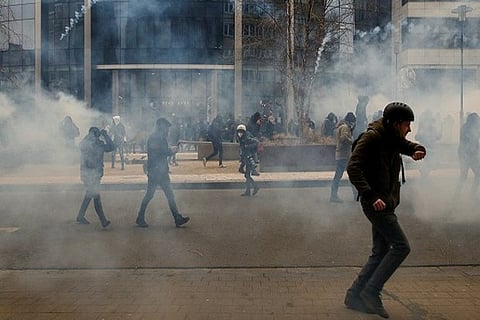 Protesters react during a demonstration against the Belgian Government's (Photo Credit: Reuters)
