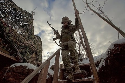 A service member of the Ukrainian armed forces walks at combat  (Image Credit: ANI)