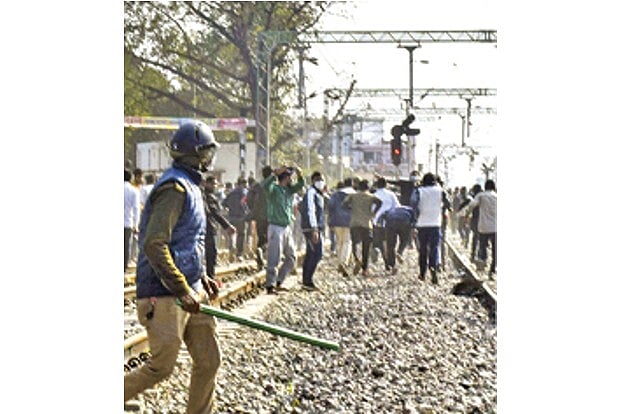 Railways suspends exams as aspirants torch train