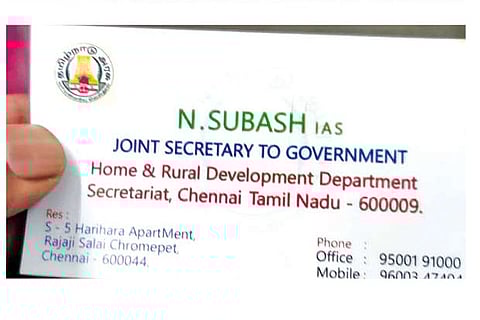 The fake business card he had been using