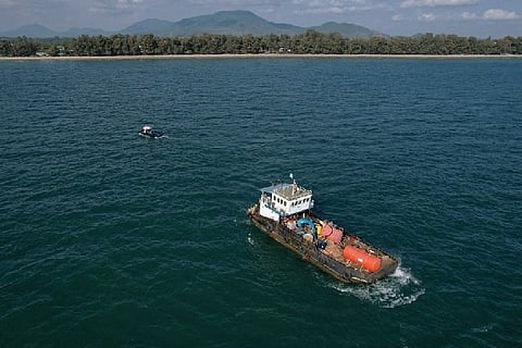 A vessel waiting for the spill to be cleaned.
