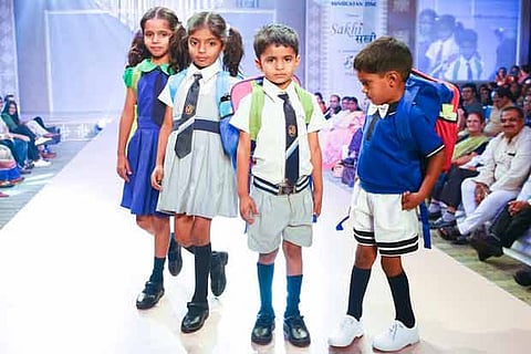 School children walking the ramp at a fashion show by Hindustan Zinc's rural women empowerment proj