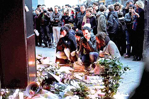 French expats brave rain to remember terror victims