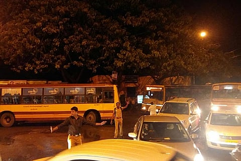 Volunteers manning traffic at the intersection of Race Course Road and Five Furlong Road in Guindy