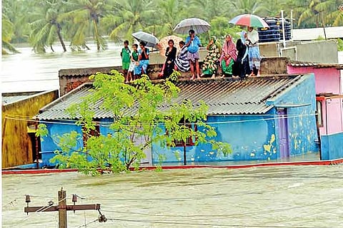 Residents perched on the roof to escape floods
