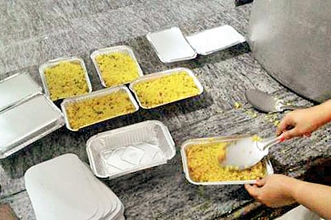 Foods being packed for flood victims at a Gurudwara