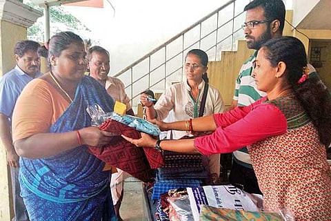 Volunteers distribute relief to those affected by the floods