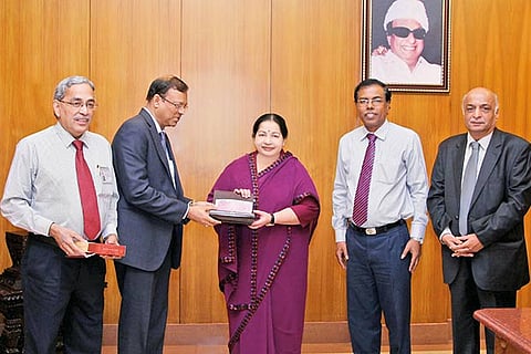 Chief Minister J Jayalalithaa receives a cheque of Rs 4.77 crore from B Ashok, Chairman, CPCL