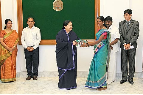 CM handing over the Siddha kit to a beneficiary