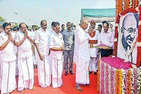 Governor K Rosaiah pays floral tributes to Mahatma Gandhi?s portrait ( Photo: Justin George)