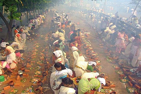 Women making pongal in a row near Attukal Bhagavathy temple in Thiruvananthapuram district