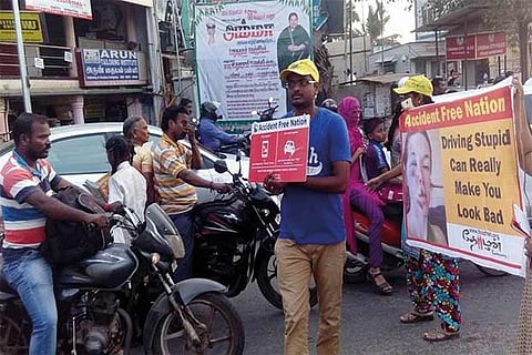 Activist on the road carrying placards to create awareness