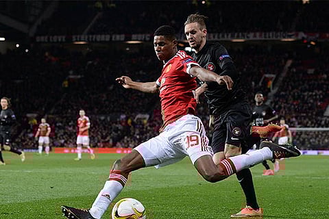 Double debut delight as Rashford rescues United