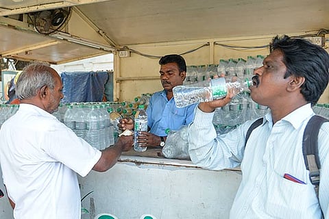 A man quenching his thirst by drinking water (Photo: Justin George)