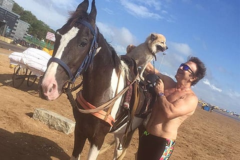 Bruce Schwack with his dog Karma