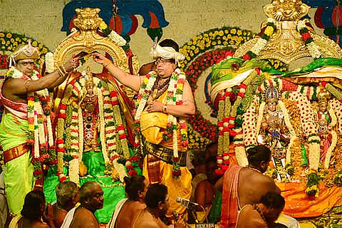 Priests perform the customary rituals at the Tirukalyanam at the Meenakshi Temple, Madurai