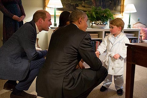 Britain?s Prince George meets with US  President Barack Obama at Kensington Palace, London on Frida