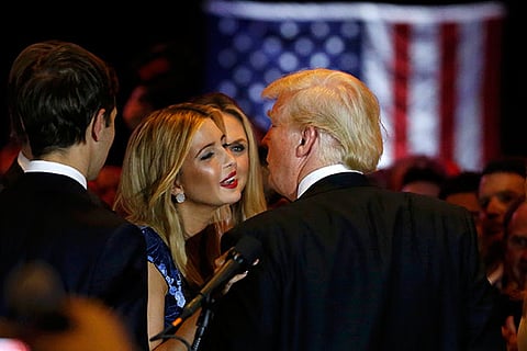 Republican US presidential candidate Donald Trump gets a kiss from his daughter Ivanka