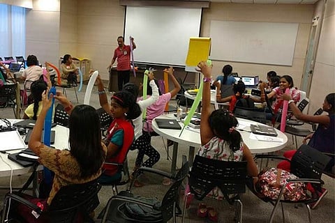Young girls in the age group of 9 to 13 learn coding at a workshop in the city