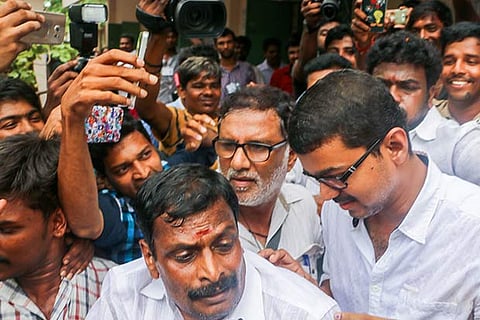 Actor Vijay mobbed by his fans when he arrived at a polling booth in Neelankarai to cast his vote