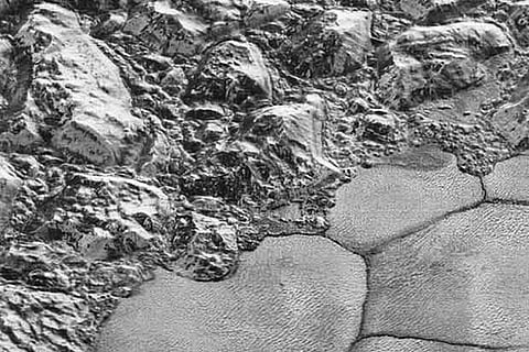 Nasa probe beams stunning close-ups of Pluto