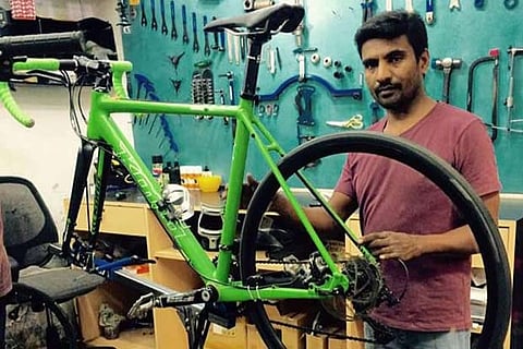 Rahman at the bicycle shop he works for in OMR