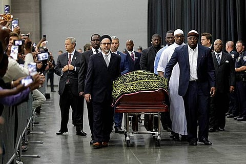 Muhammad Ali's casket arrives at Freedom Hall for a traditional Islamic Muslim service