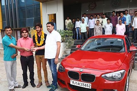 Going Viral: Student gets BMW from coaching institute for doing well in IIT-JEE