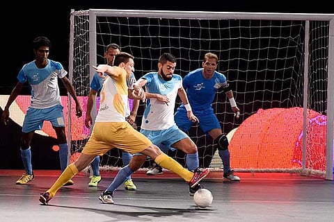 Mumbai 5's and Chennai 5's (yellow) players in action at Premier Futsal Football League in Chennai