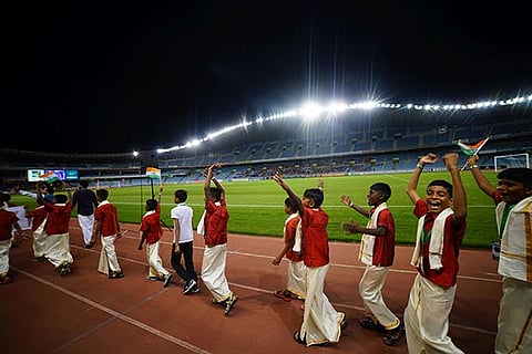 Dreamfooters team walking around the stadium in Spain in the traditional veshti