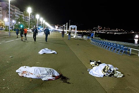Bodies are seen on the ground after at least 84 people were killed in Nice, France