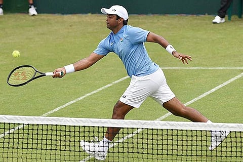 Leander Paes plays a shot during India?s Davis Cup doubles match against Korea