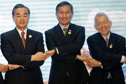 Chinese Foreign Minister (FM) Wang Yi, Singapore FM Vivian Balakrishnan and Philippine FM Yasay Jr