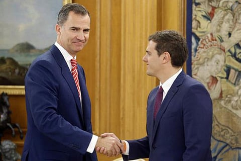 Spain's King Felipe (L) greets Ciudadanos' leader Albert Rivera before their meeting in Madrid