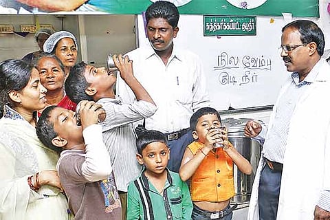 File photo of children getting a dose of the health drink