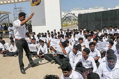 Students of Tamil Nadu Dr Ambedkar Law University  staging a protest near the campus in Perungudi